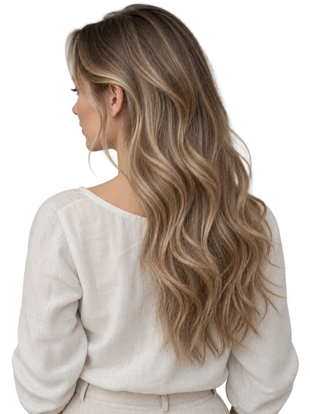 Back view of a woman with long, softly waved dark blonde hair.