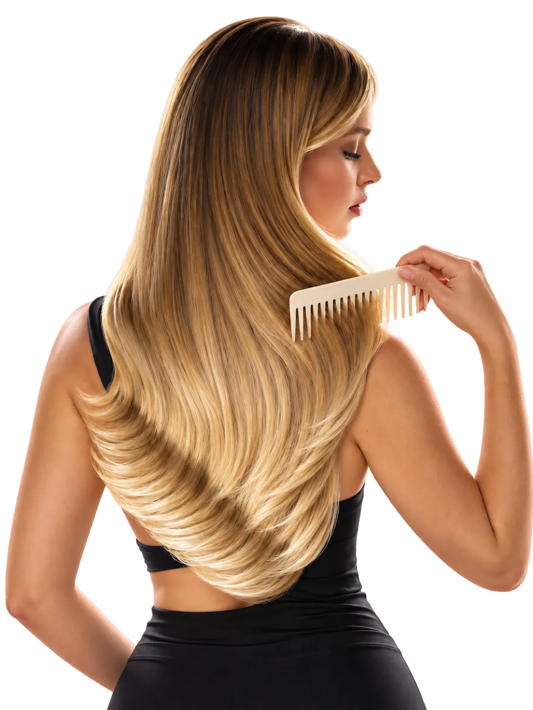 A client combing through long, glossy blonde hair after a finish.